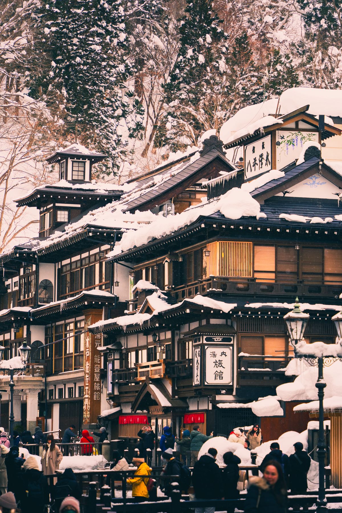 A traditional public bathhouse in the snow at Kinosaki Onsen