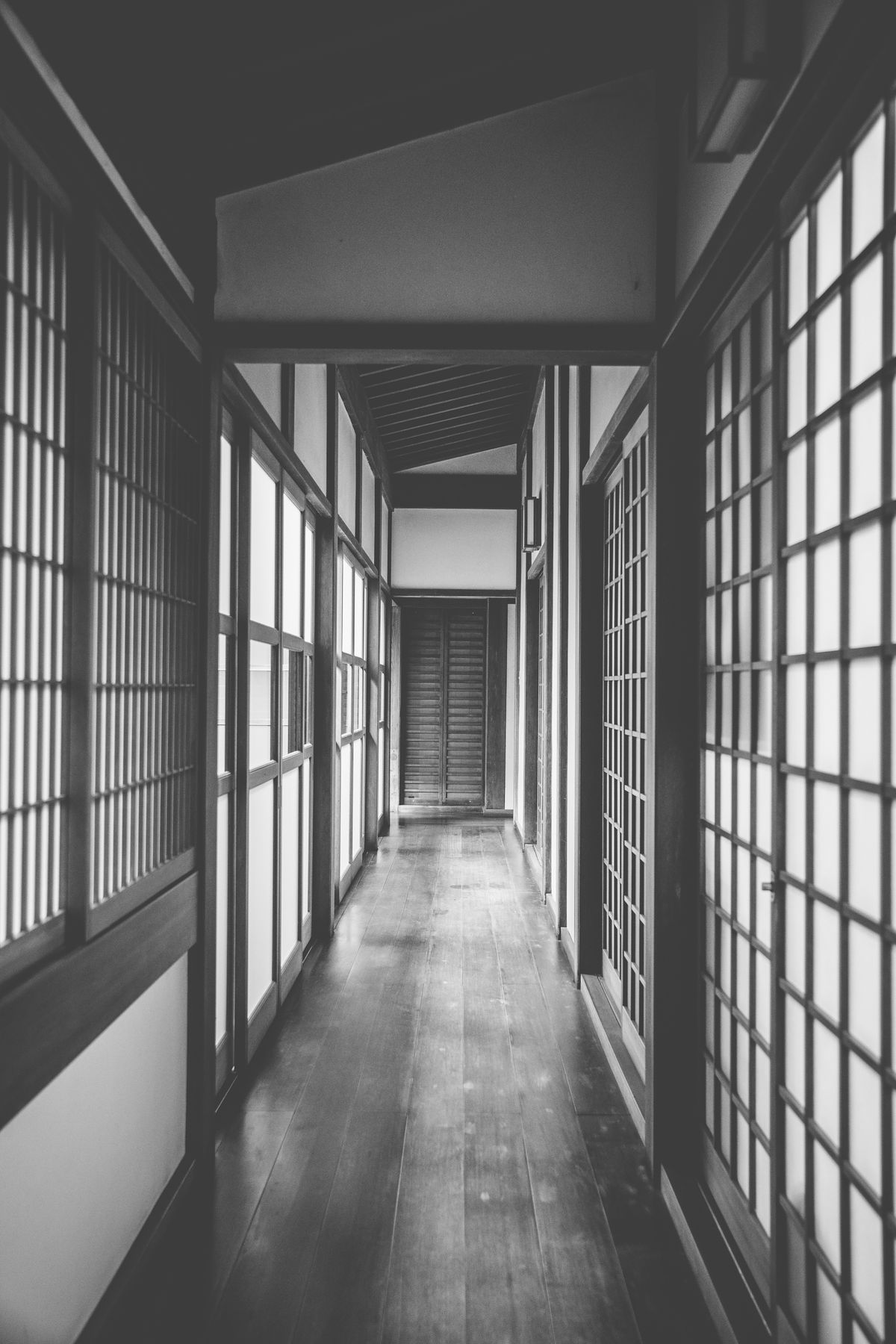 A wooden corridor inside a traditional Japanese inn